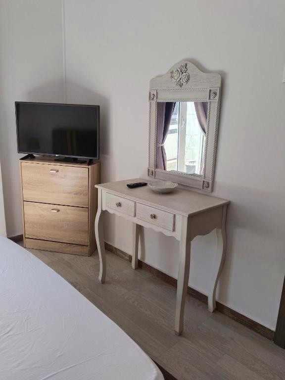 Dressing table with mirror and TV