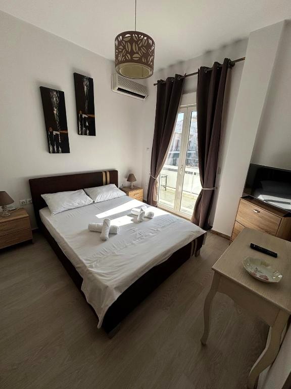 Bedroom with double bed and balcony door
